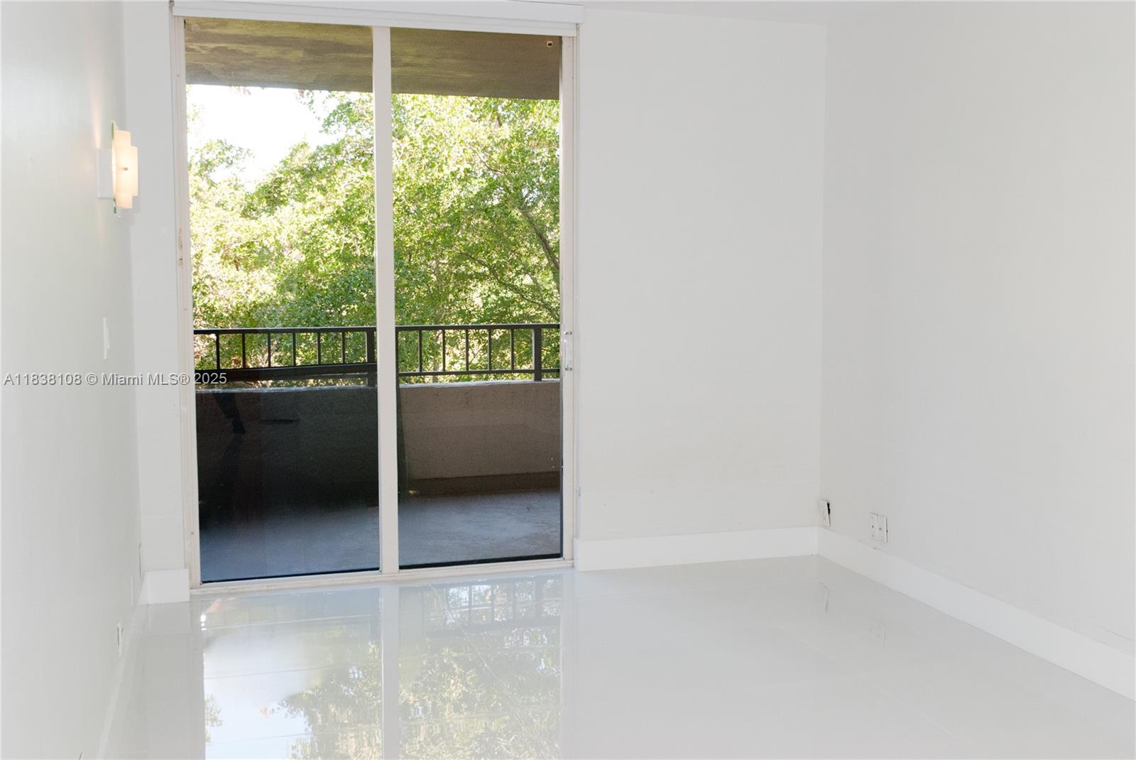 141 Crandon Boulevard, Unit 342 Key Biscayne, FL 33149 - Photo 8 of 25 a view of an empty room and window