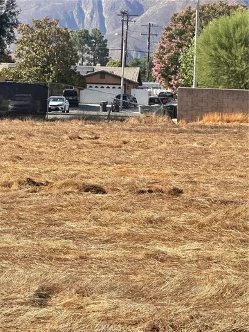 a swimming pool with some trees in the background