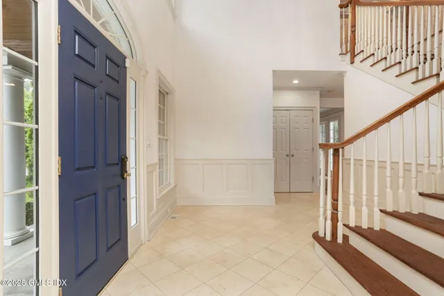 a bathroom with a granite countertop sink a mirror and a shower