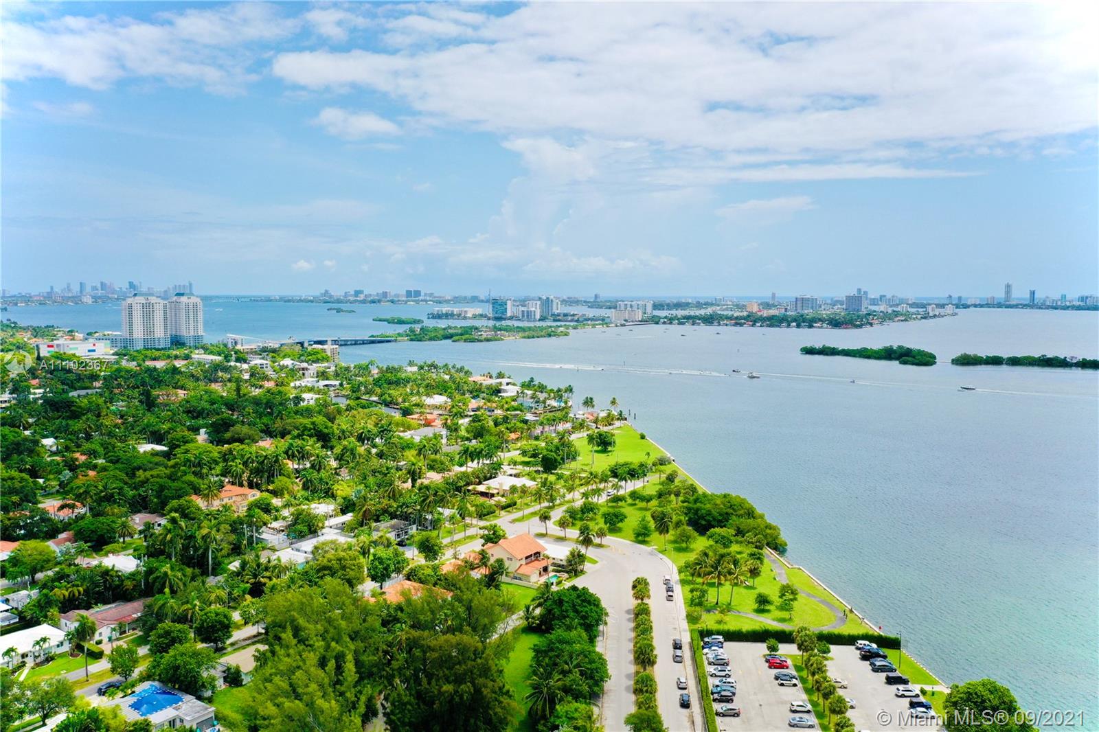 880 Northeast 69th Street, Unit 1D Miami, FL 33138 - Photo 3 of 15 a view of a lake with a city