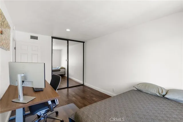 a bedroom with a bed and a table in it