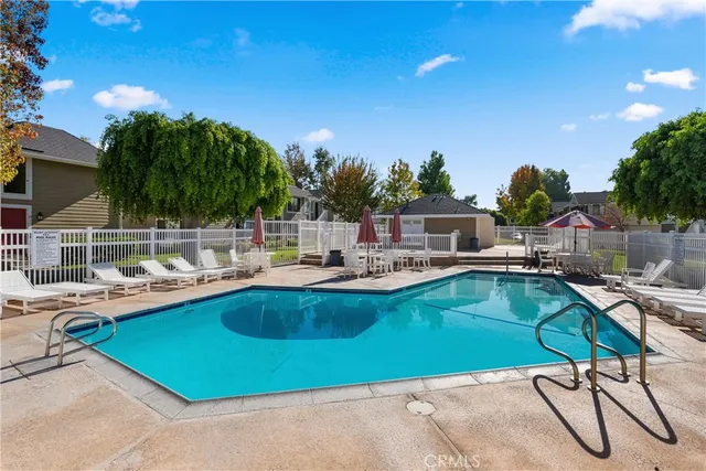 a view of swimming pool with chairs