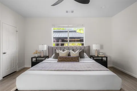 a bedroom with bed and a window