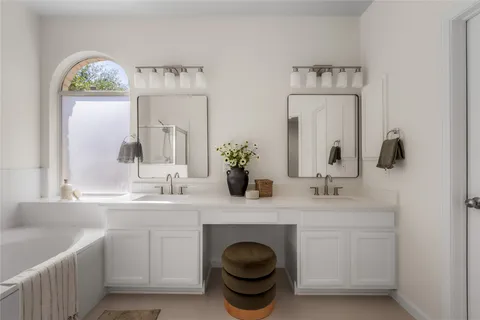 a bathroom with a sink a toilet and vanity