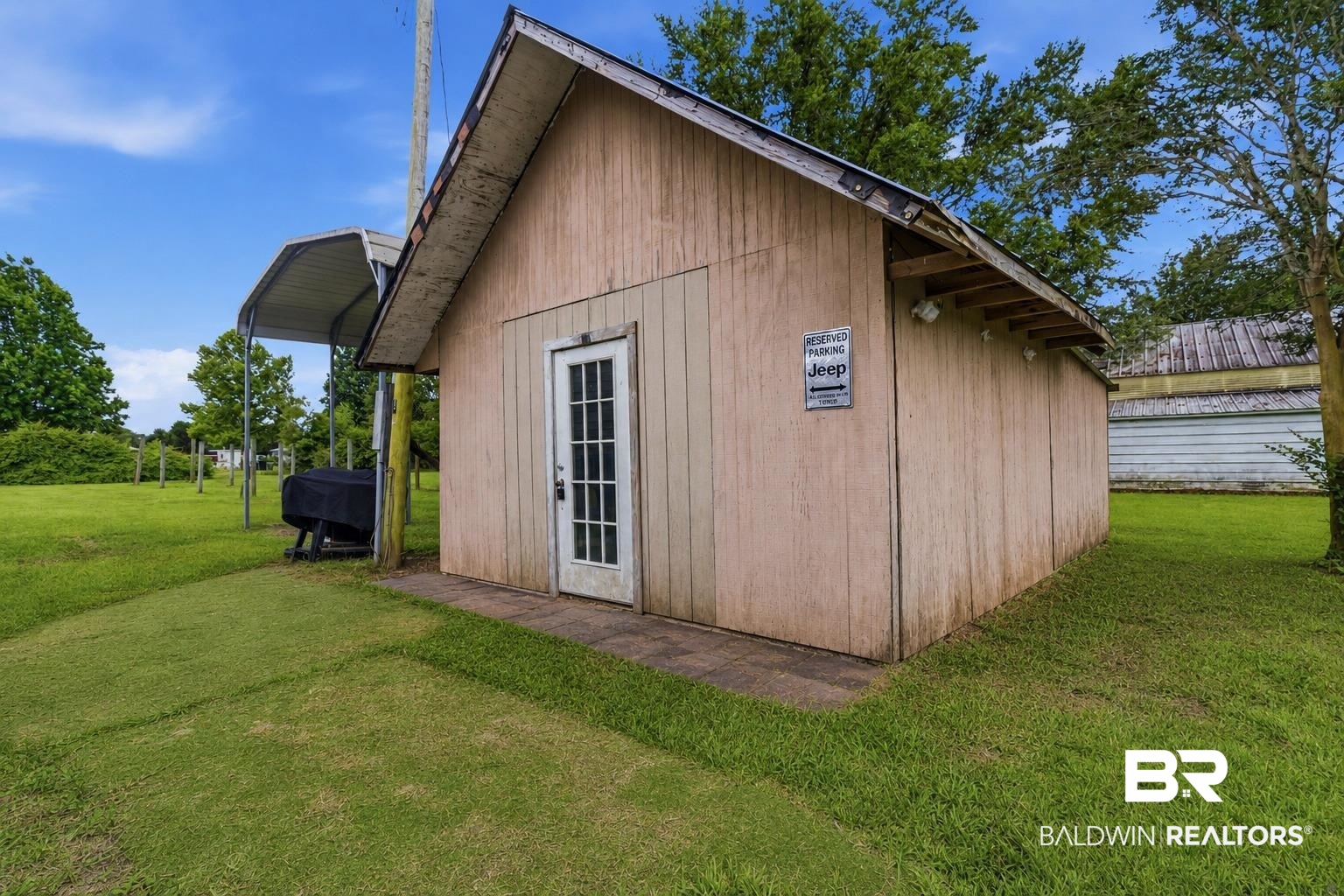 26788 Feely Road Elberta, AL 36530 - Photo 19 of 31 Detached utility building with a single entry door and an attached metal carport