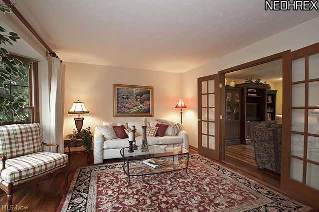 357 Longspur Road Highland Heights, OH 44143 - Photo 7 of 22 Living room is highlighted by a large walk-in bay window and French doors opening to the Family room