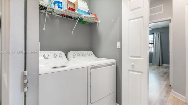 a utility room with dryer and washer