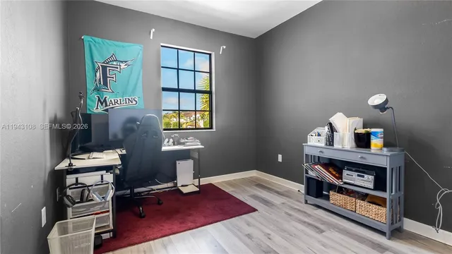 a workspace with furniture and a window