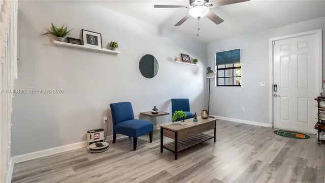 a work room with furniture and wooden floor