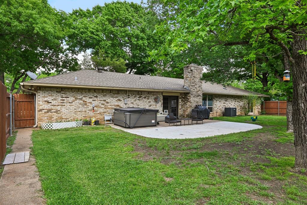 305 South Cockrell Hill Road Ovilla, TX 75154 - Photo 29 of 40 a view of a house with a yard and sitting area