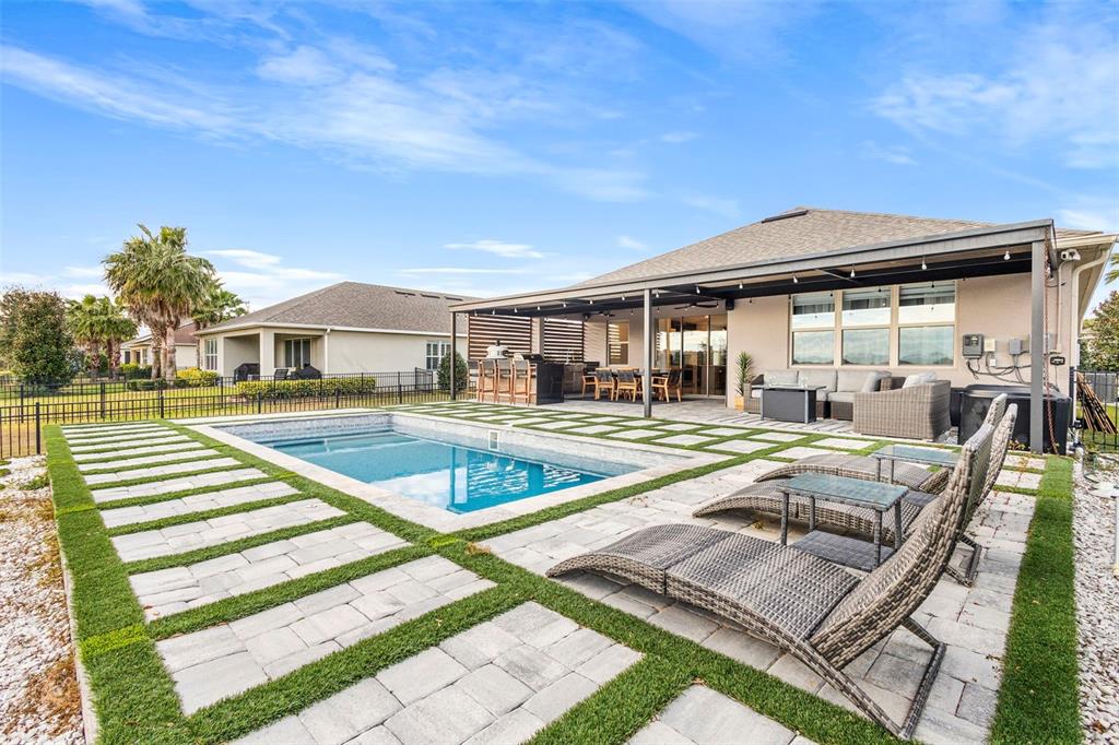 2342 Kaley Ridge Road Clermont, FL 34715 - Photo 11 of 54 a view of a house with swimming pool and porch with furniture