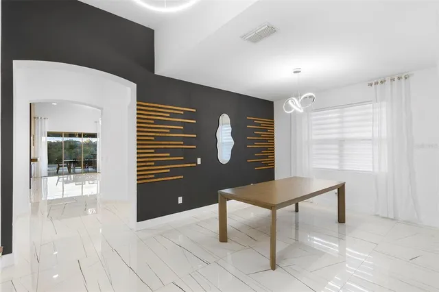 a kitchen with stainless steel appliances a refrigerator and a stove top oven