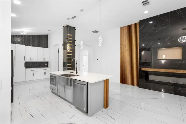 a terrace of a house with outdoor seating