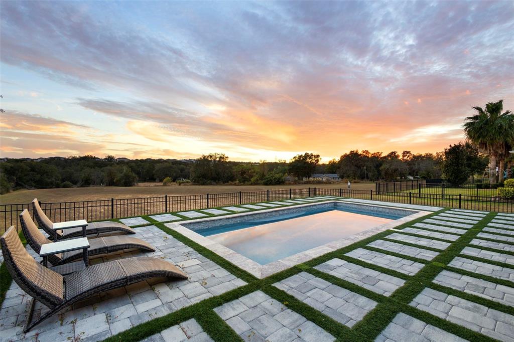 2342 Kaley Ridge Road Clermont, FL 34715 - Photo 22 of 54 a view of a roof deck with couches and sky view