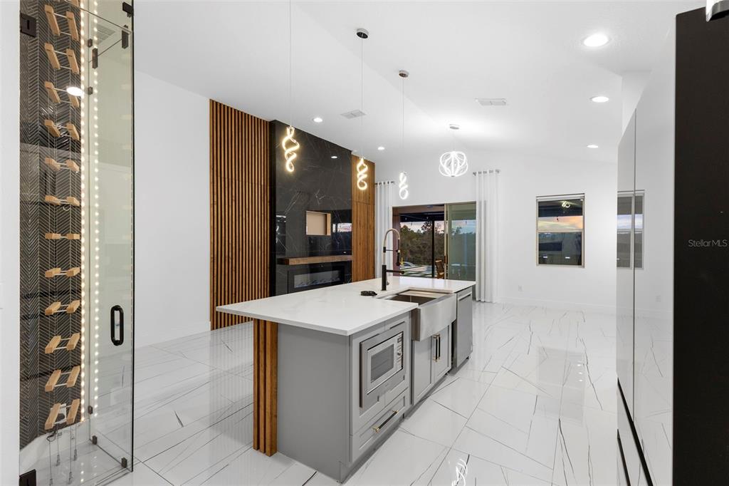 2342 Kaley Ridge Road Clermont, FL 34715 - Photo 28 of 54 a kitchen with a sink and a refrigerator