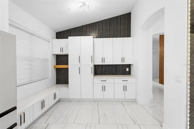 a view of balcony with two chairs and a rug