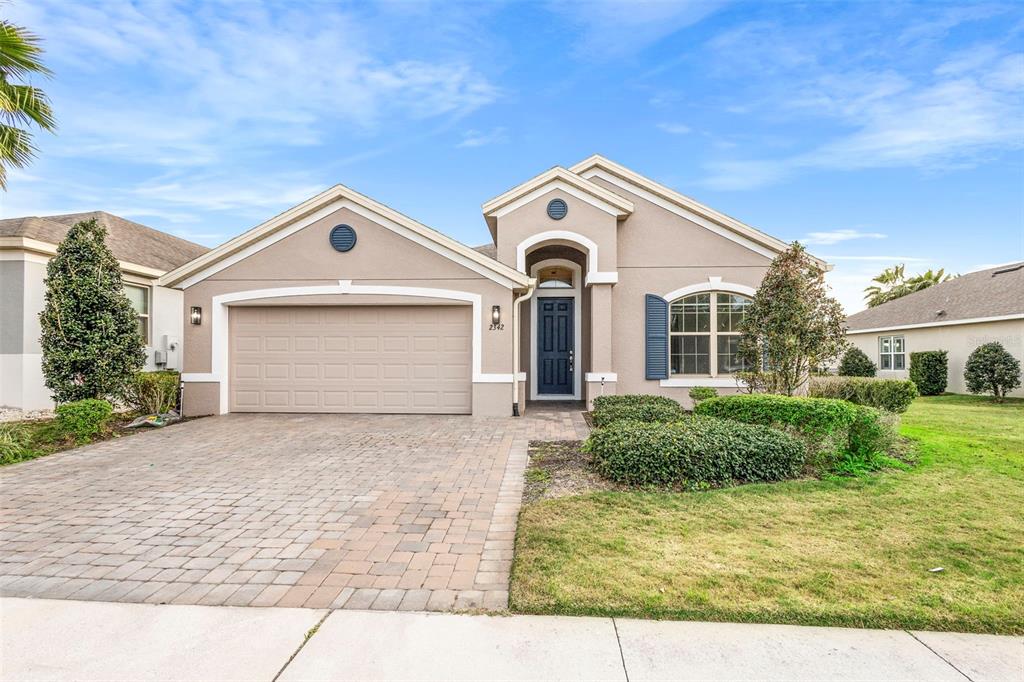2342 Kaley Ridge Road Clermont, FL 34715 - Photo 3 of 54 a front view of a house with garden