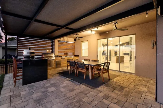 a bathroom with a bathtub sink double vanity and mirror