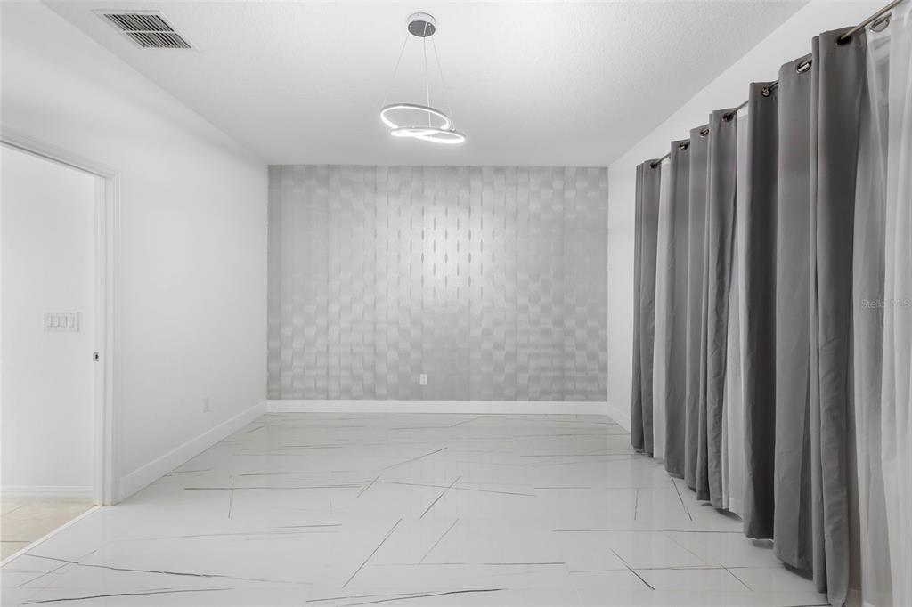 2342 Kaley Ridge Road Clermont, FL 34715 - Photo 37 of 54 a view of an empty room with wooden floor