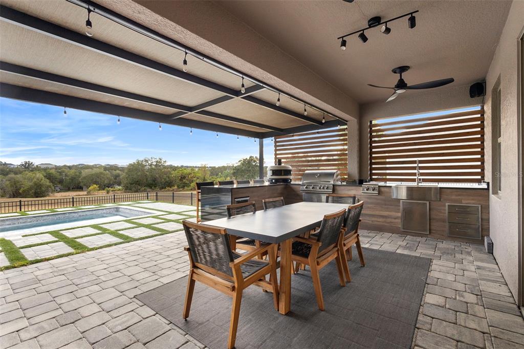 2342 Kaley Ridge Road Clermont, FL 34715 - Photo 46 of 54 a view of a dining table and chairs in the patio