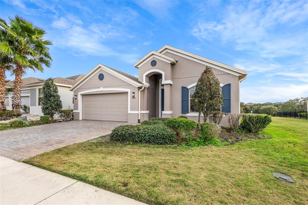 2342 Kaley Ridge Road Clermont, FL 34715 - Photo 5 of 54 a front view of a house with garden