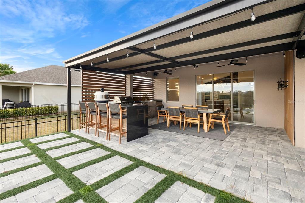 2342 Kaley Ridge Road Clermont, FL 34715 - Photo 51 of 54 a view of a porch with chairs and floor to ceiling window