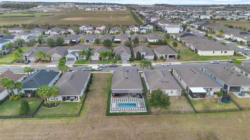 2342 Kaley Ridge Road Clermont, FL 34715 - Photo 9 of 54 an aerial view of residential houses with outdoor space and parking