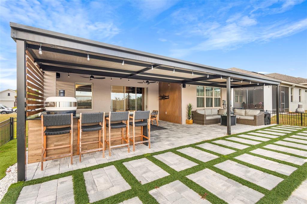 2342 Kaley Ridge Road Clermont, FL 34715 - Photo 10 of 54 a view of a patio with table and chairs with wooden floor and fence