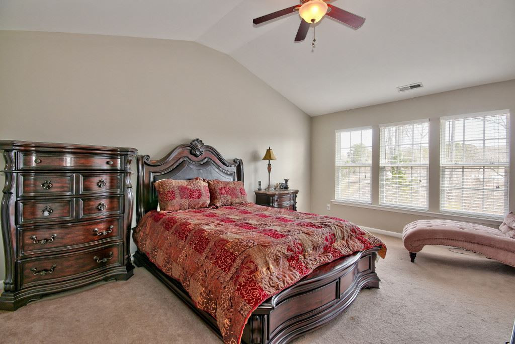 7754 San Gabriel Street Raleigh, NC 27613 - Photo 16 of 25 Cathedral ceilings with ceiling fan, very large bedroom includes an en suite. Master Bedroom