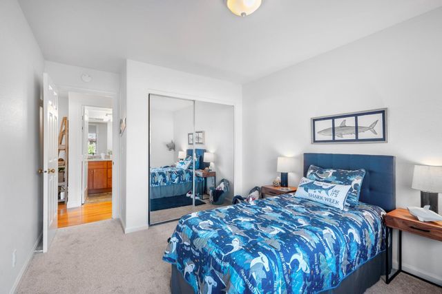 a bedroom with a bed and a view of bedroom