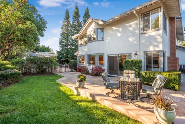 a view of a patio with chairs and tables