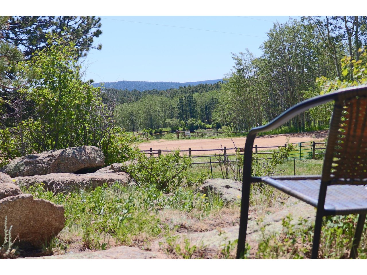 636 Ranch Road Ward, CO 80481 - Photo 22 of 24 Take a seat and look out over Penny Lake one of the neighborhood's three stocked fishing lakes, located just a stone's throw from your property.
