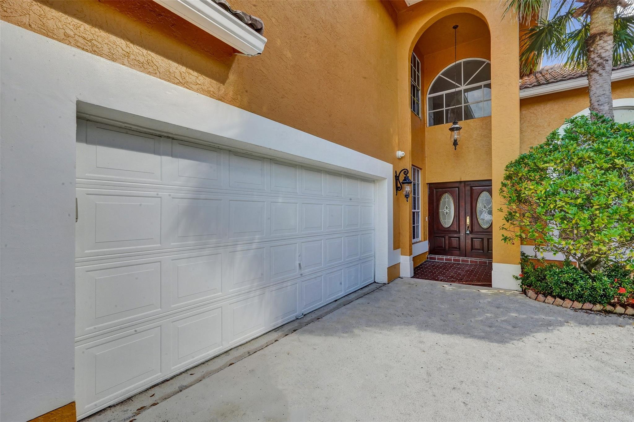 10902 Tamoron Lane Boca Raton, FL 33498 - Photo 3 of 66 a view of a house with a garage