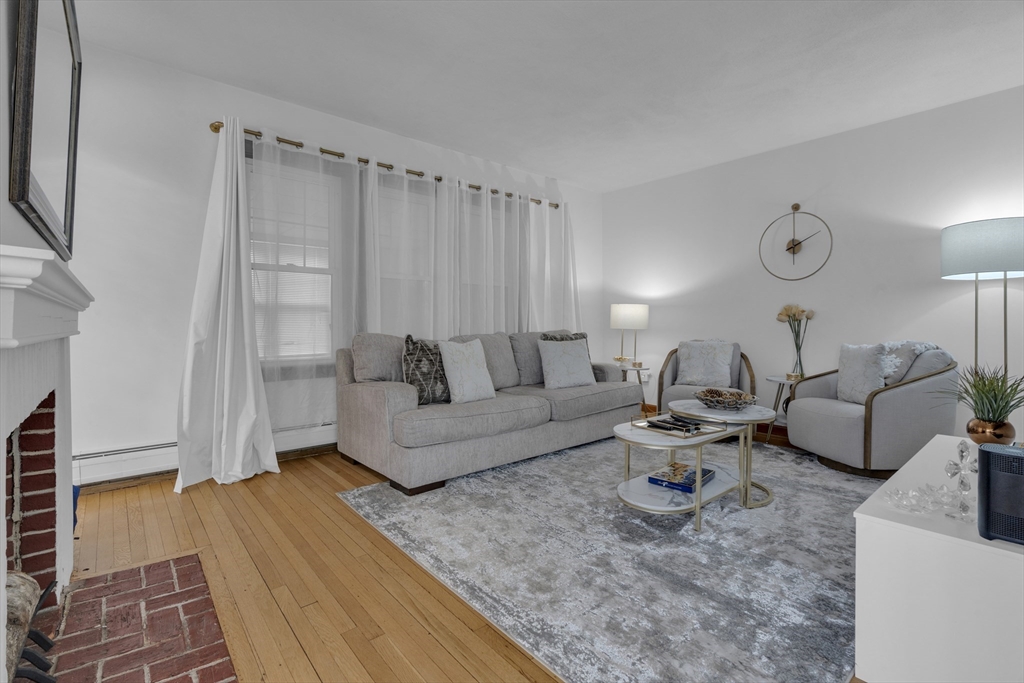 64 Commonwealth Road Watertown, MA 02472 - Photo 6 of 23 a living room with furniture and a rug