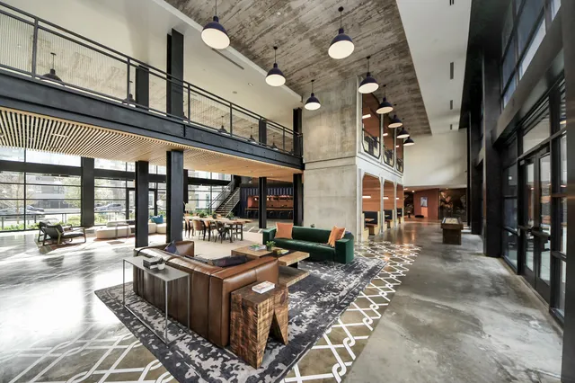 a living room with furniture and a table