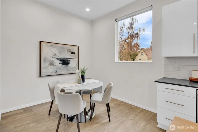 a dining room with furniture and window