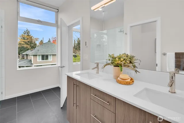 a kitchen with a sink cabinets and wooden floor