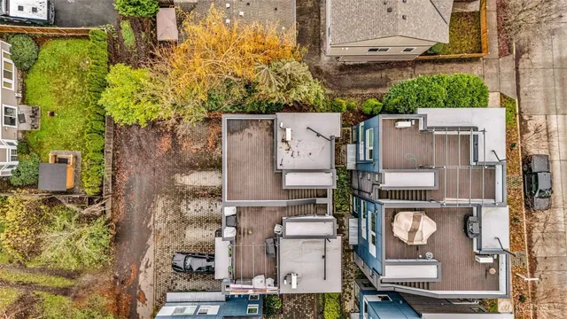 an aerial view of residential house with outdoor space and parking