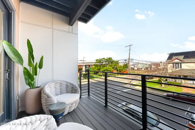 a view of a balcony with chairs