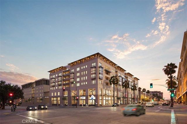a view of a street with a building in the background