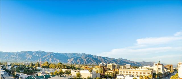 a view of a backyard with furniture and a small cabin