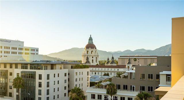a front view of a residential apartment building with a yard