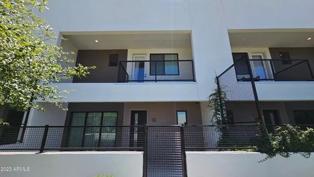 front view of a house with a potted plant