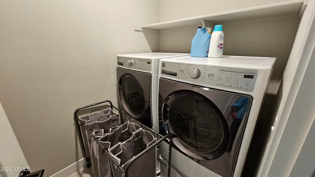 a utility room with dryer and washer