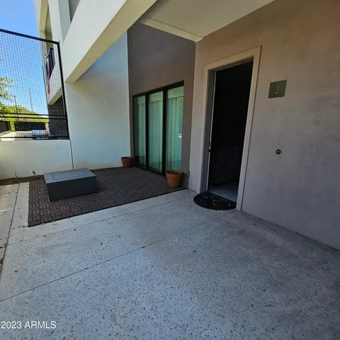 a view of an empty room with windows