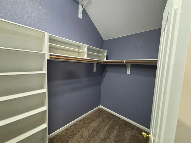 a view of an empty walk in closet
