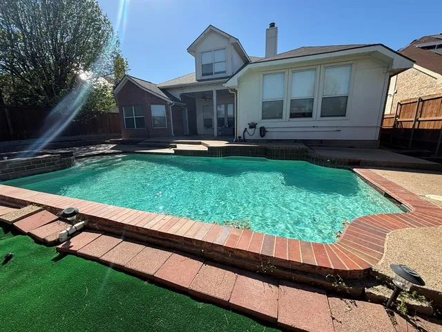 a front view of house with yard and outdoor seating