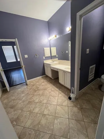 a view of a backyard with wooden fence