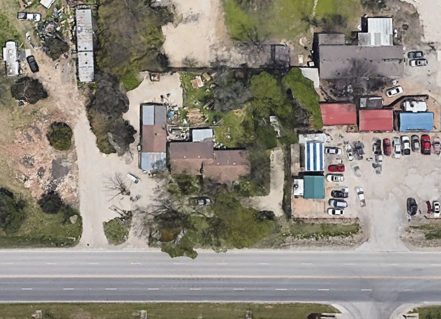 9104 Farm To Market Road 812 Austin, TX 78719 - Photo 2 of 3 an aerial view of a houses with yard