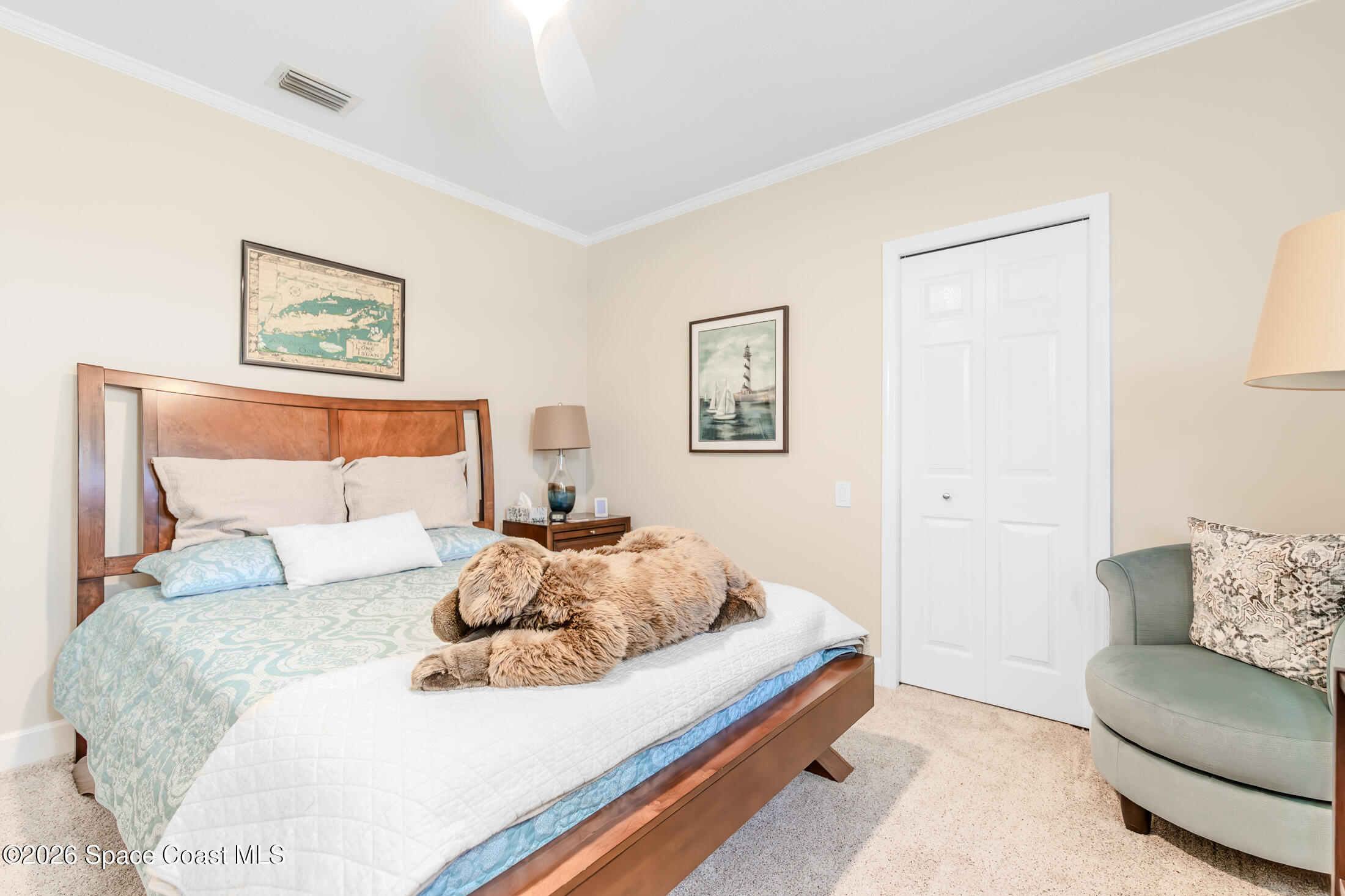8201 Compton Way Melbourne, FL 32940 - Photo 32 of 52 a bedroom with a bed and a couch